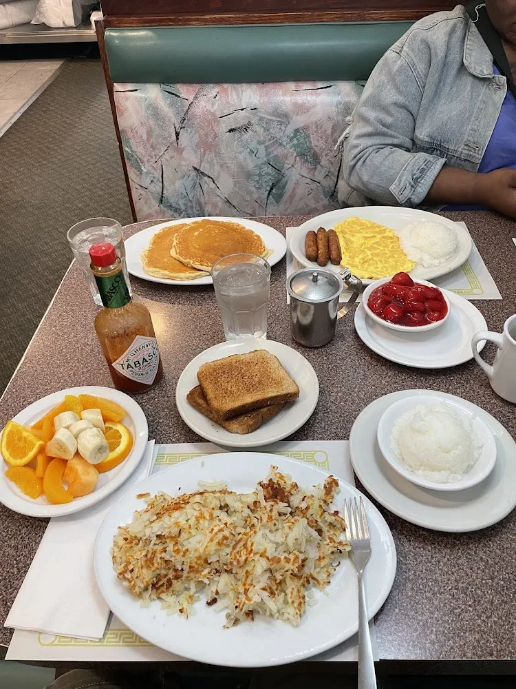 Hash Browns Grits Wheat Toast Fruit Plate Turkey Sausage Eggs Pancakes